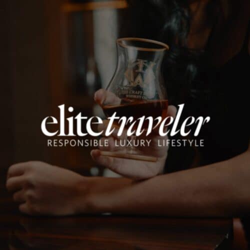 Elite Traveler logo and quality handcrafted whiskey