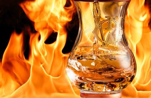 A glass of the best single malt Irish whiskey and fire