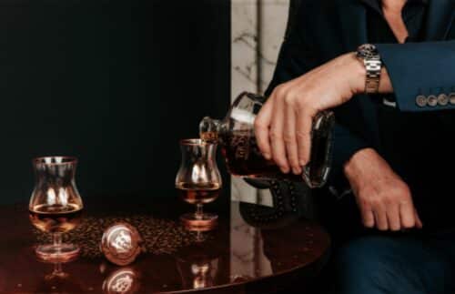 A man pouring luxury whiskey into a glass