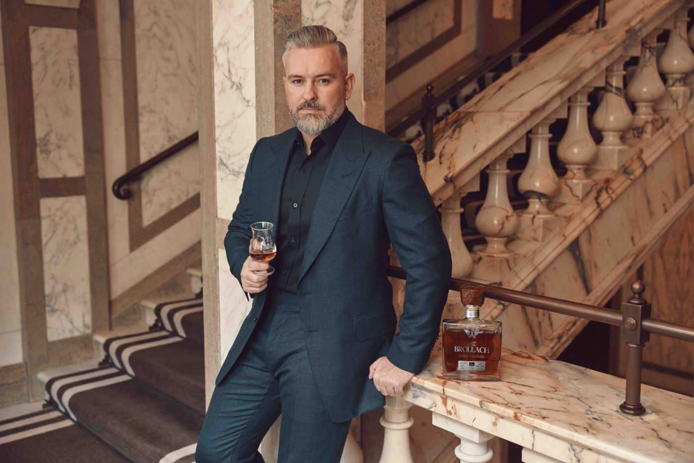 Jay Bradley holding a glass of the best whiskey in the world