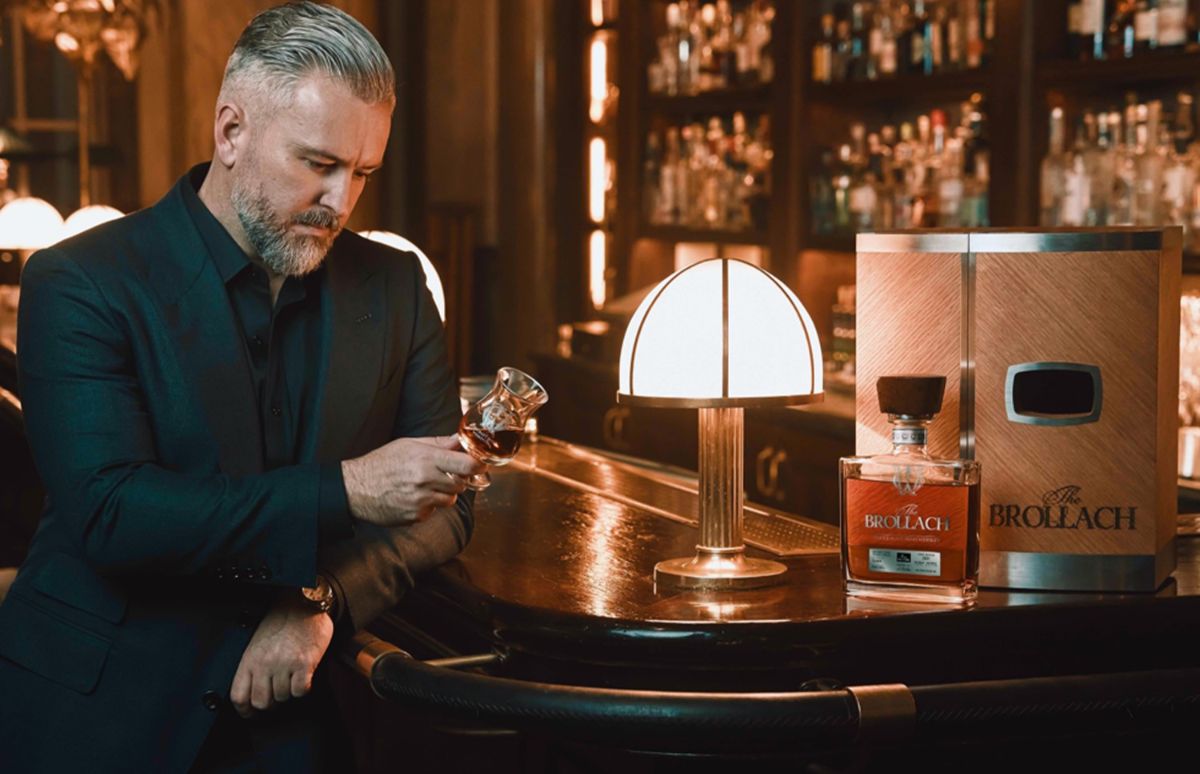 Jay Bradley holding a glass of rare Irish whiskey 