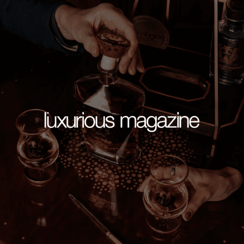 Luxurious magazine cover with a bottle of luxury whiskey and two whiskey glasses