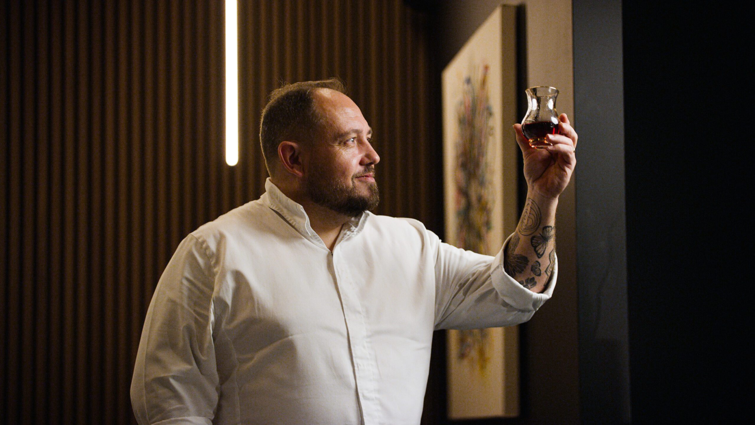 James Sommerin holding a luxury Irish whiskey glass
